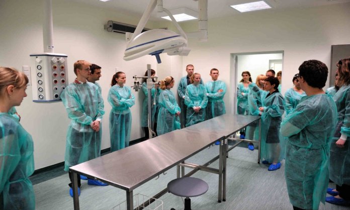 Medical students being prepared for test operations
