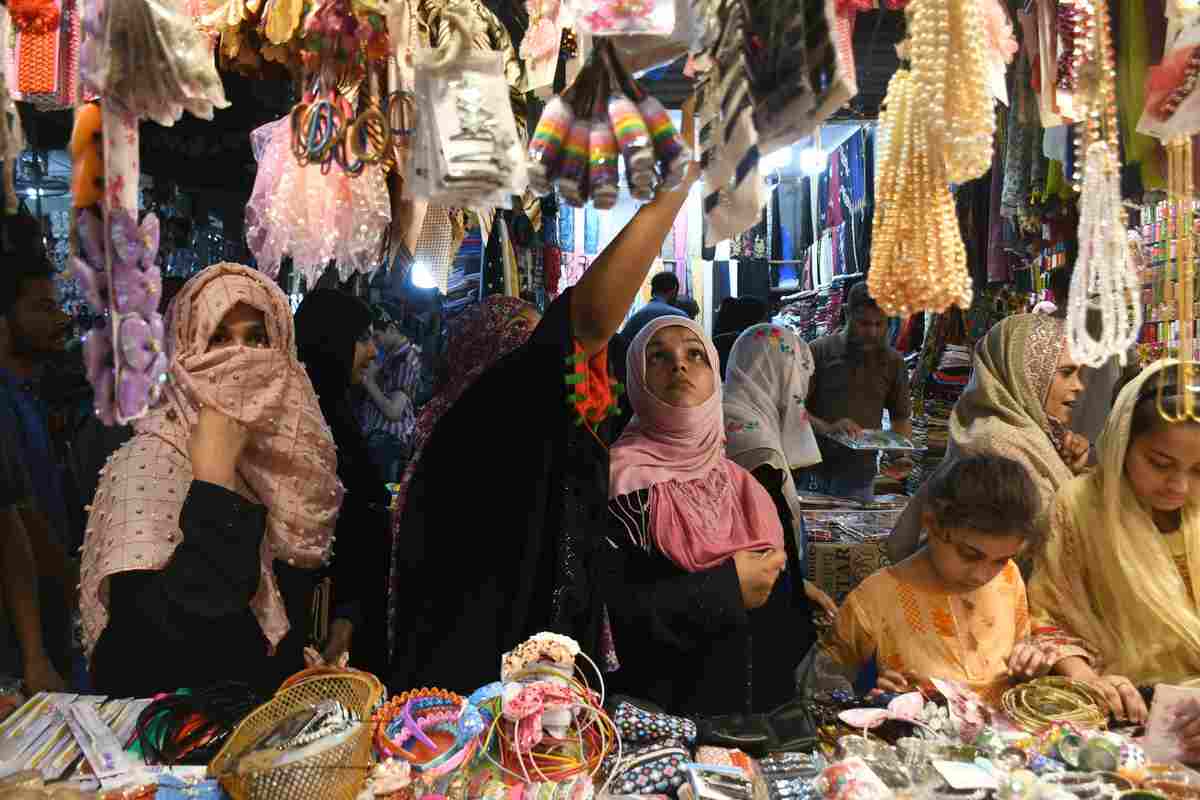 Women and girls buy jewelry at a shop in Karachi, Pakistan