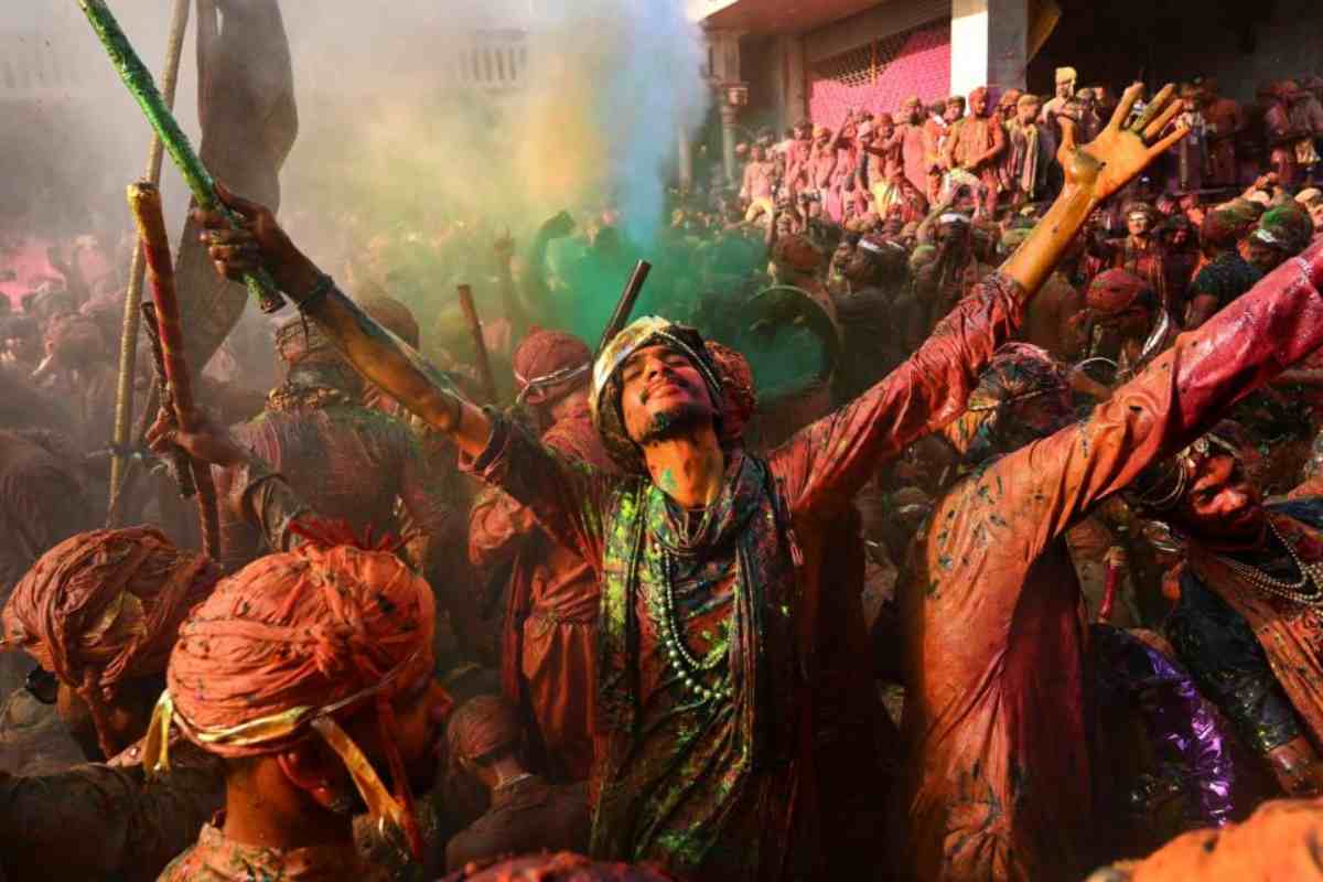 Villagers from Barsana and Nandgaon sing and dance as they participate in Lathmar Holi 