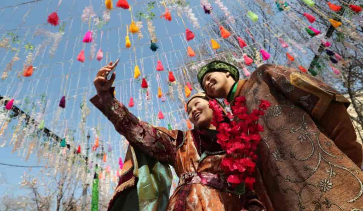 Participants take a selfie during a festival marking ‘Nowruz’, an ancient holiday celebrating the spring equinox, in Kazakhstan